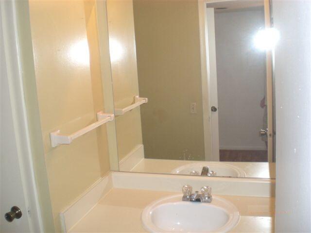 4341 West McNab Road, Unit 29 Pompano Beach, FL 33069 - Photo 8 of 10 a bathroom with a sink and a mirror