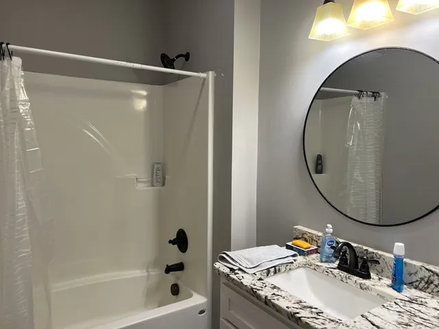 a bathroom with a sink and a mirror