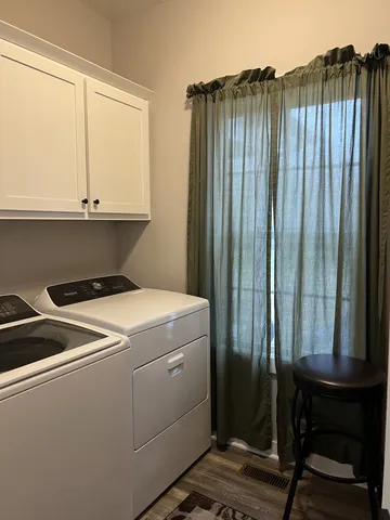 a utility room with dryer and washer