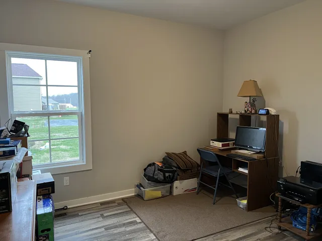 a room with furniture and a window