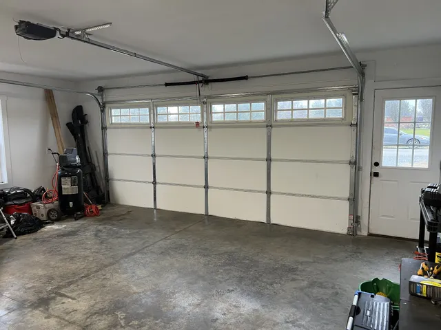 a view of a garage with rack and bicycle