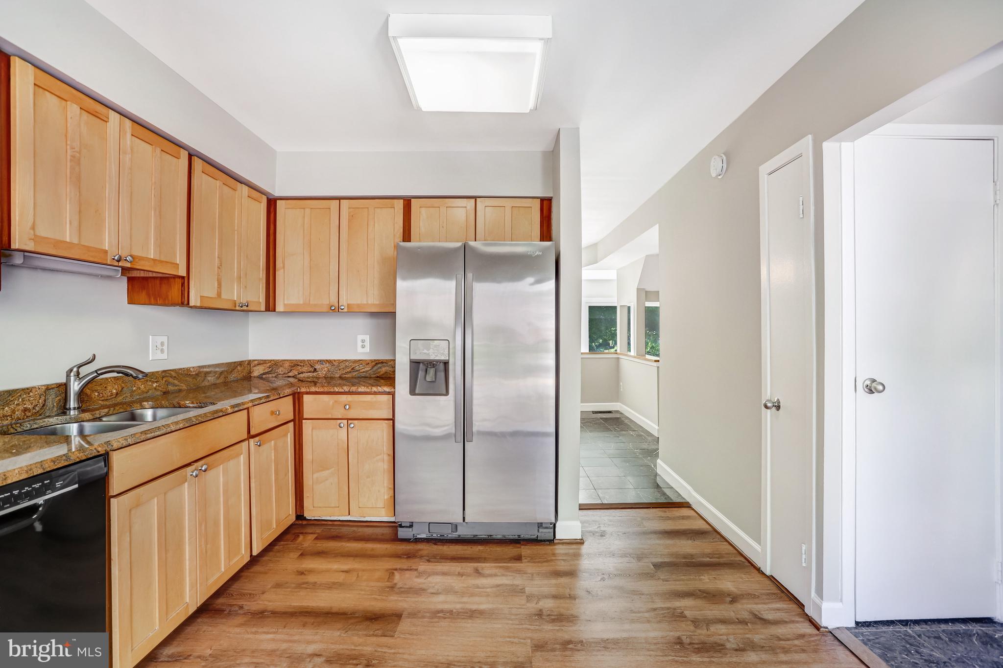 1953 Lakeport Way Reston, VA 20191 - Photo 20 of 60 a kitchen with stainless steel appliances granite countertop a refrigerator and a sink