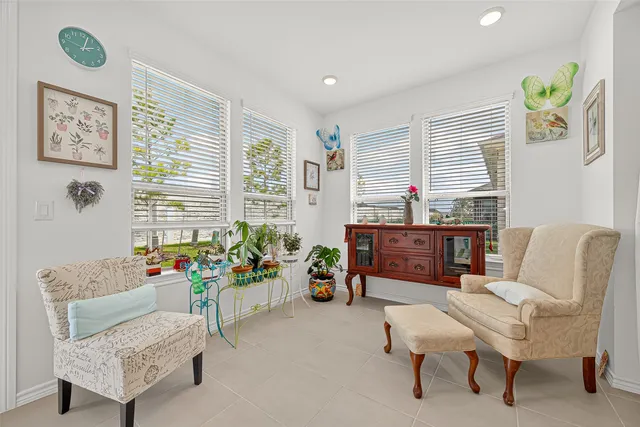 a living room with furniture and a window