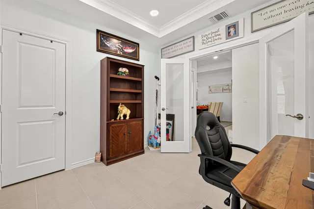 a view of a workspace with furniture and closet