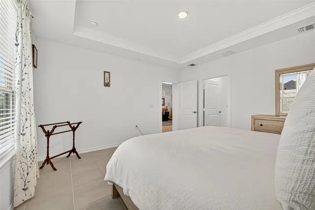 a bedroom with a bed and chair