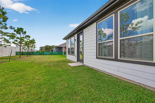 a view of an house with backyard space and garden