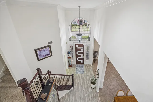 a view of a hallway with furniture
