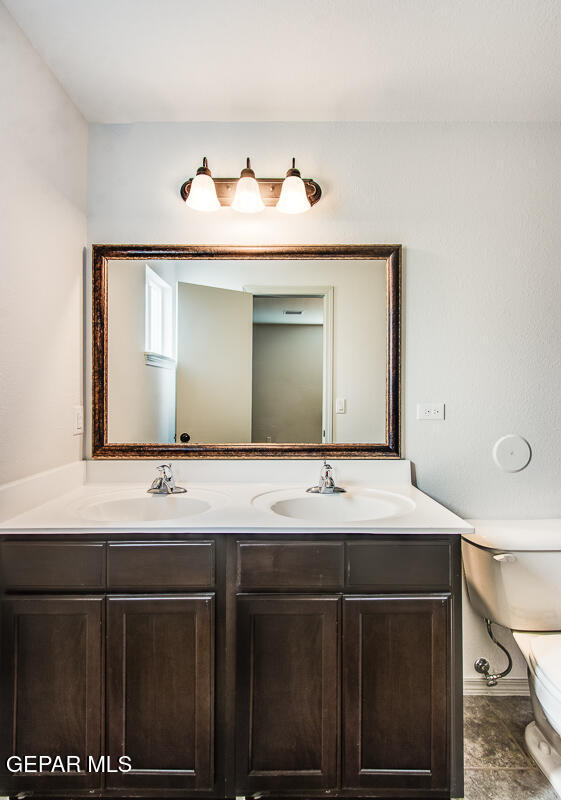 12420 Oconee Place Clint, TX 79836 - Photo 4 of 27 a bathroom with a sink and a mirror
