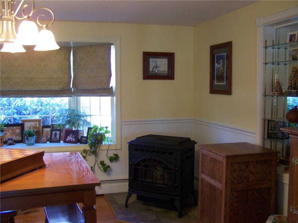 324 Hanson Ridge Road Sanford, ME 04083 - Photo 13 of 33 Pellet stove in dining room adds...