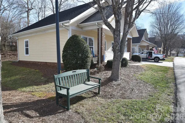 a view of a bench in the backyard