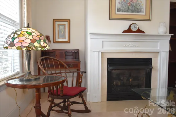 a view of a livingroom with furniture and chandelier