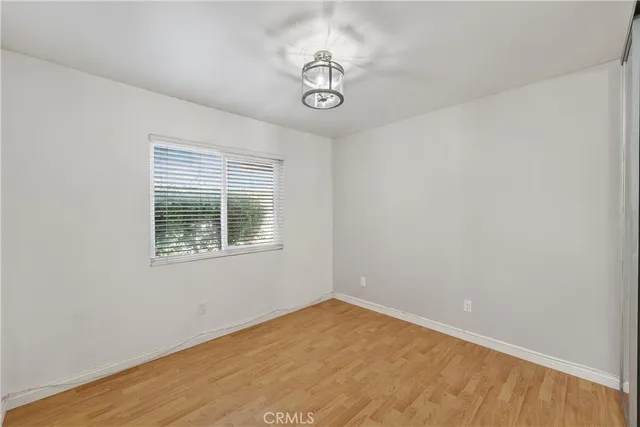 a front view of a house with a yard and a garden