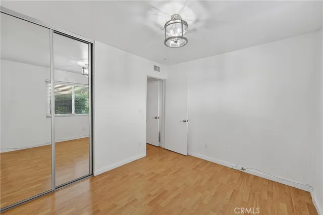 a kitchen with cabinets and white appliances