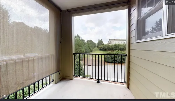 a view of a balcony with wooden floor