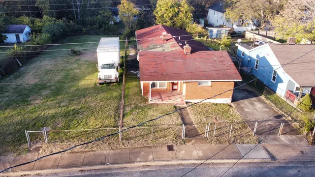 a aerial view of a house with a yard