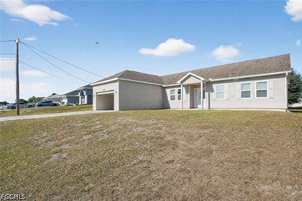 2808 34th Street Southwest Lehigh Acres, FL 33976 - Photo 2 of 14 a view of an house with backyard space