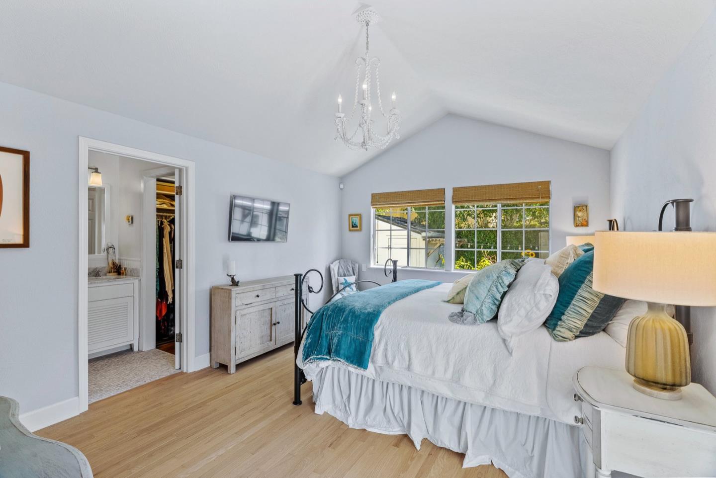 4940 Capitola Road Capitola, CA 95010 - Photo 13 of 25 a bedroom with a bed and wooden floor
