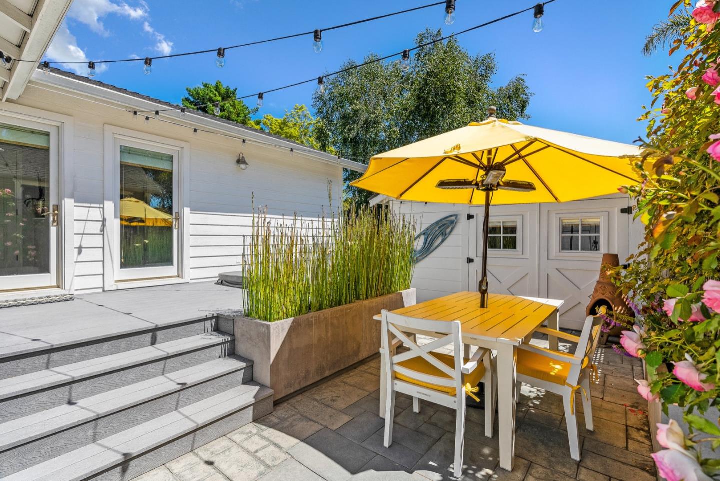4940 Capitola Road Capitola, CA 95010 - Photo 16 of 25 a view of a swimming pool with a table and chairs under an umbrella