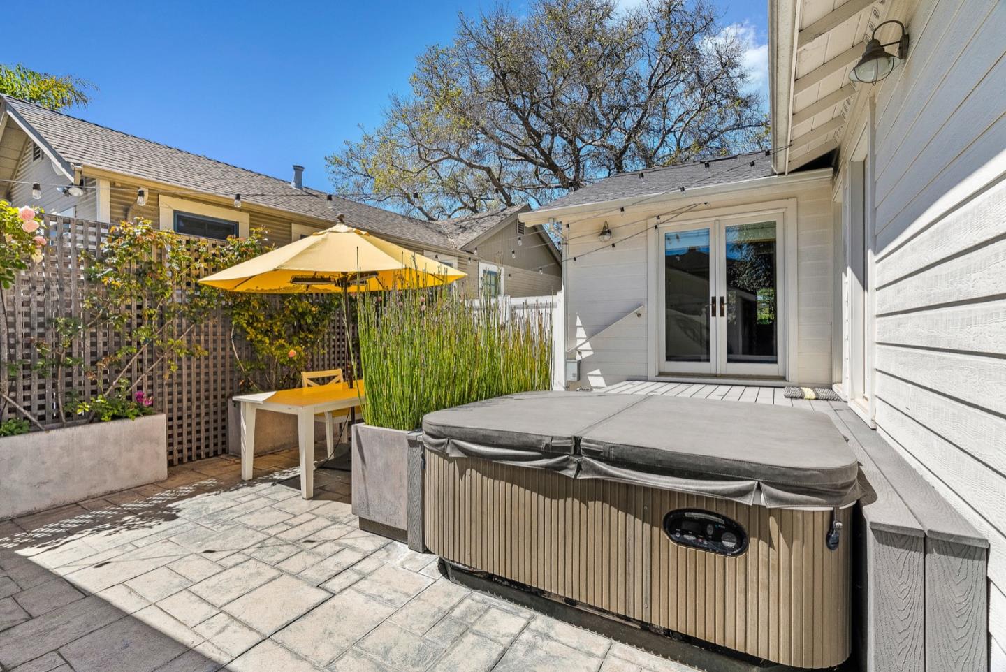 4940 Capitola Road Capitola, CA 95010 - Photo 17 of 25 a view of a patio with table and chairs
