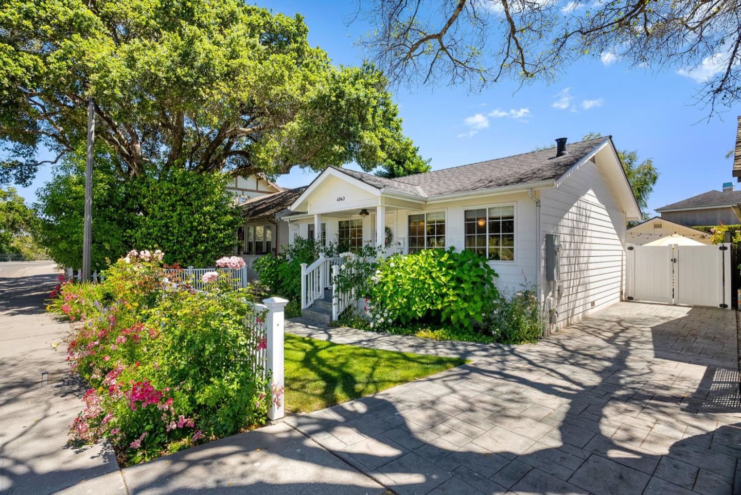 4940 Capitola Road Capitola, CA 95010 - Photo 24 of 25 a front view of a house with a yard and a garden