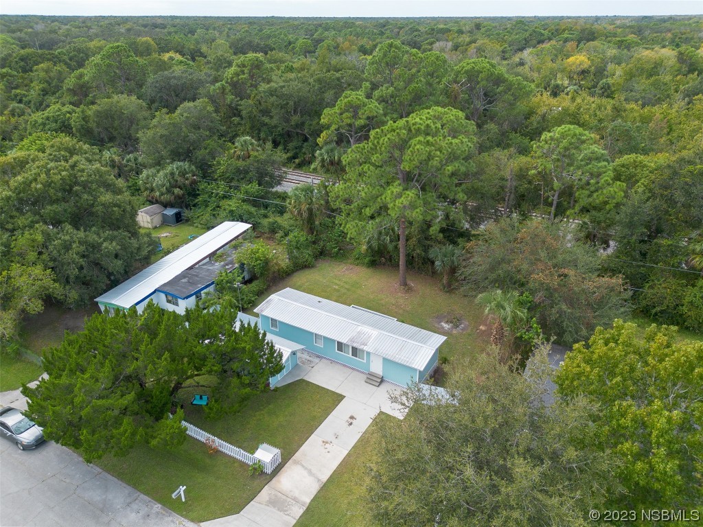 153 West Loop Oak Hill, FL 32759 - Photo 23 of 32 an aerial view of a house with a yard