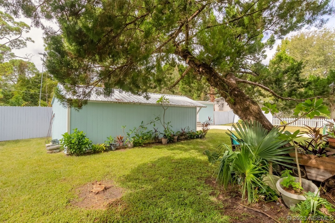 153 West Loop Oak Hill, FL 32759 - Photo 5 of 32 a view of a backyard
