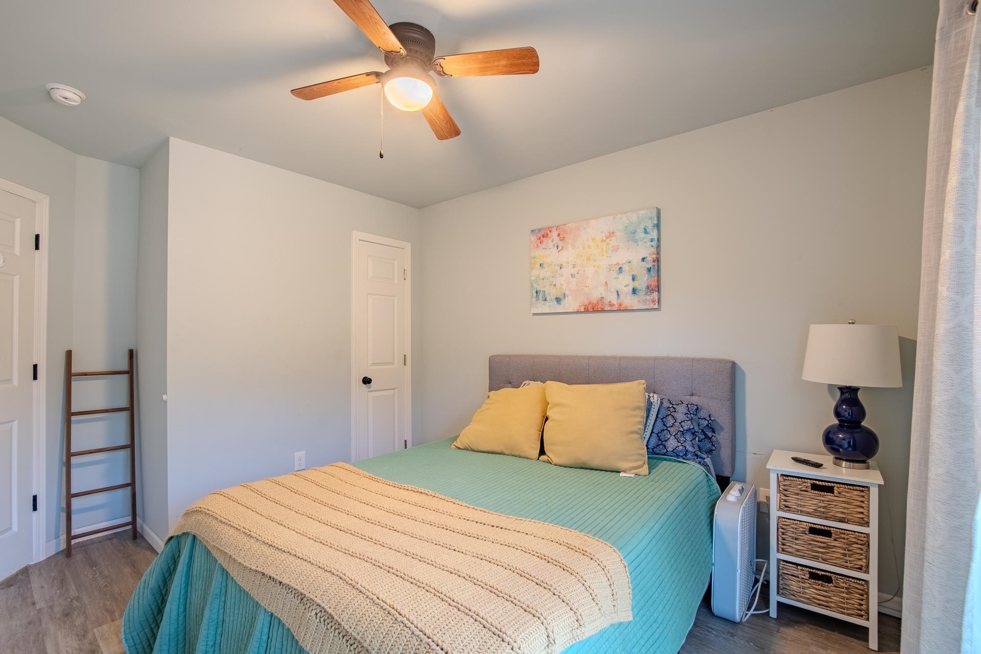 25 Bogey Loop Counce, TN 38326 - Photo 30 of 37 Bedroom with wood finished floors and a ceiling fan
