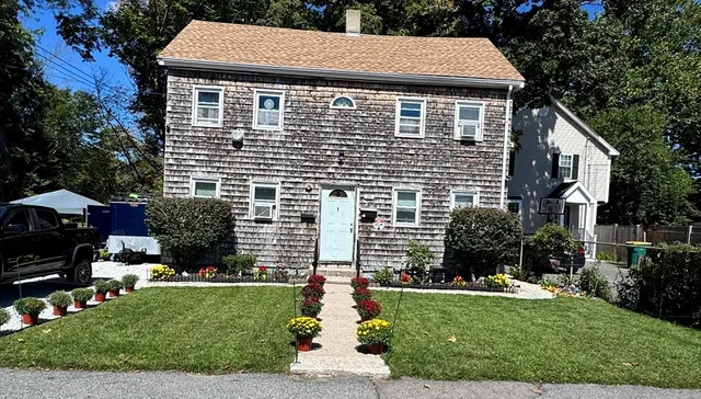 a aerial view of a house with a yard