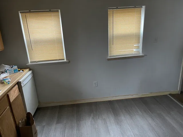 a utility room with window and dryer