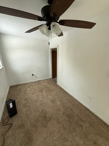 en empty room with wooden floor