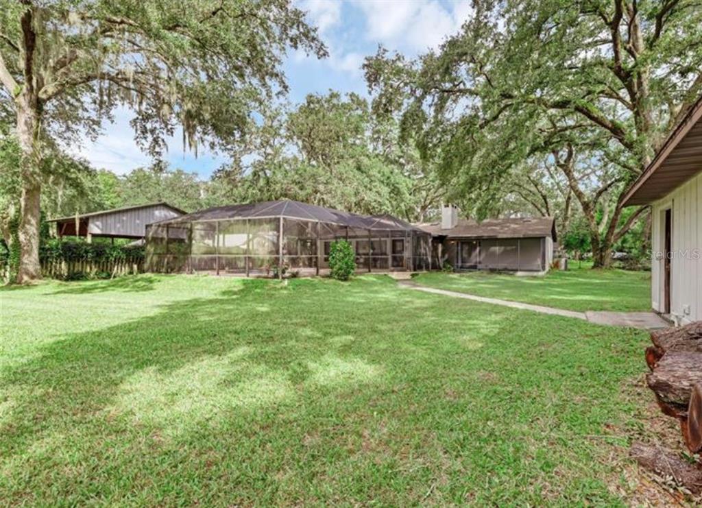 4308 Allen Road Fruitland Park, FL 34731 - Photo 31 of 33 a front view of house with yard and green space