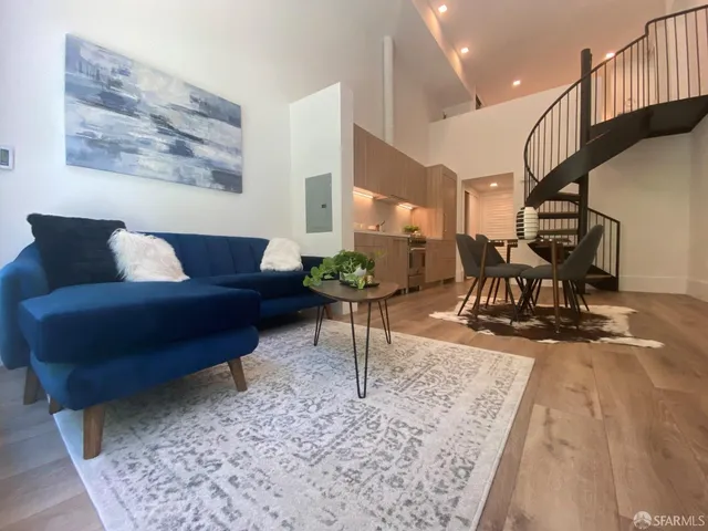 a living room with furniture or wooden floor and a chandelier