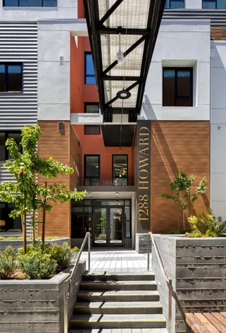 a view of a patio with table and chairs and potted plants