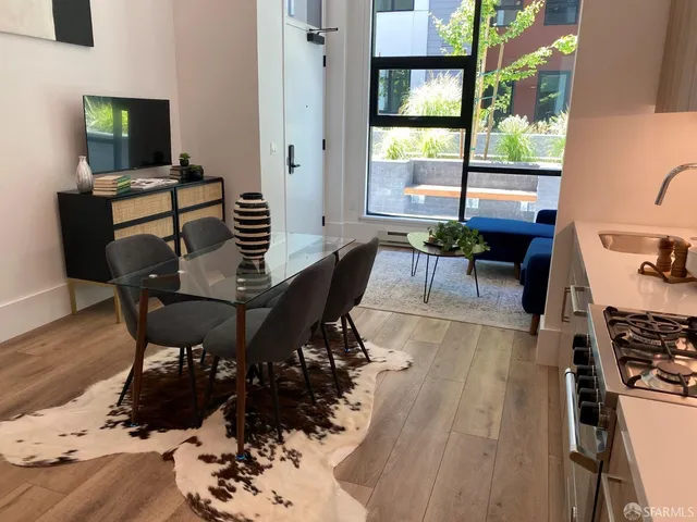 a view of a dining room with furniture window and outside view