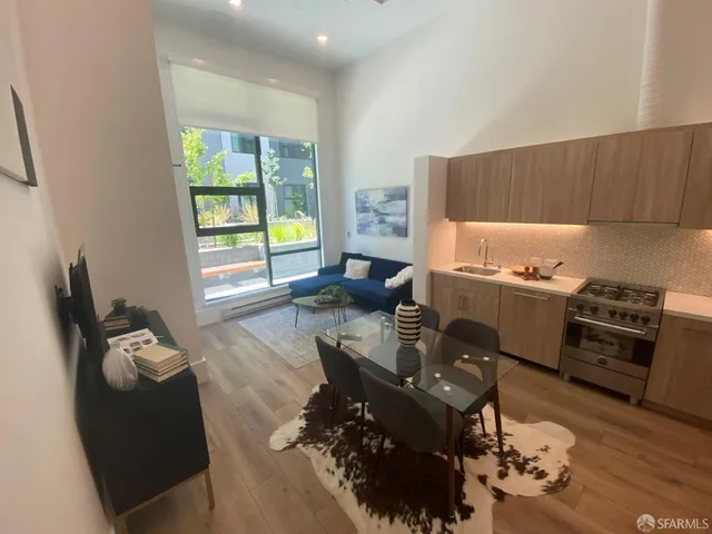 a living room with furniture windows and a fireplace