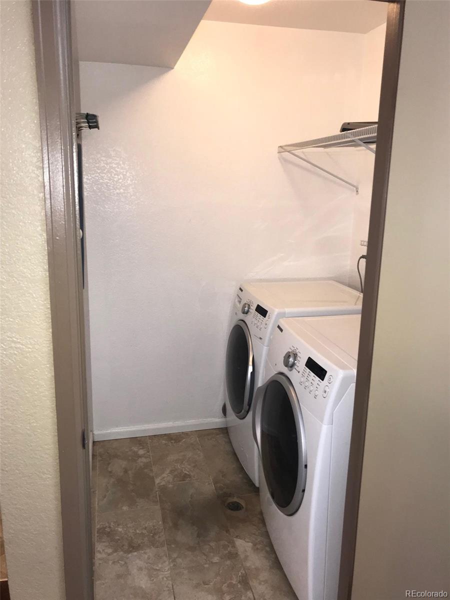 5556 Flanders Way Denver, CO 80249 - Photo 12 of 23 a utility room with dryer and washer
