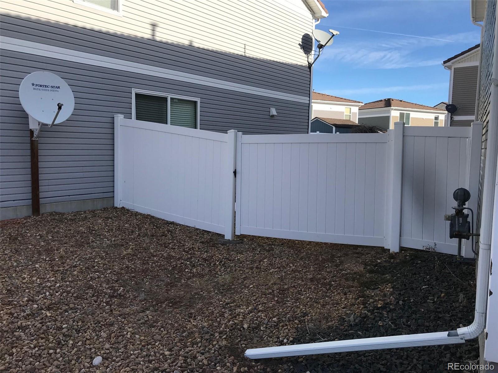 5556 Flanders Way Denver, CO 80249 - Photo 23 of 23 a view of a backyard