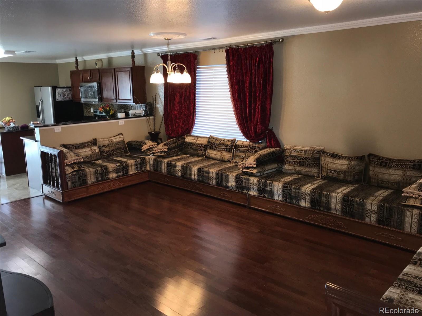 5556 Flanders Way Denver, CO 80249 - Photo 5 of 23 a view of a room with gym equipment