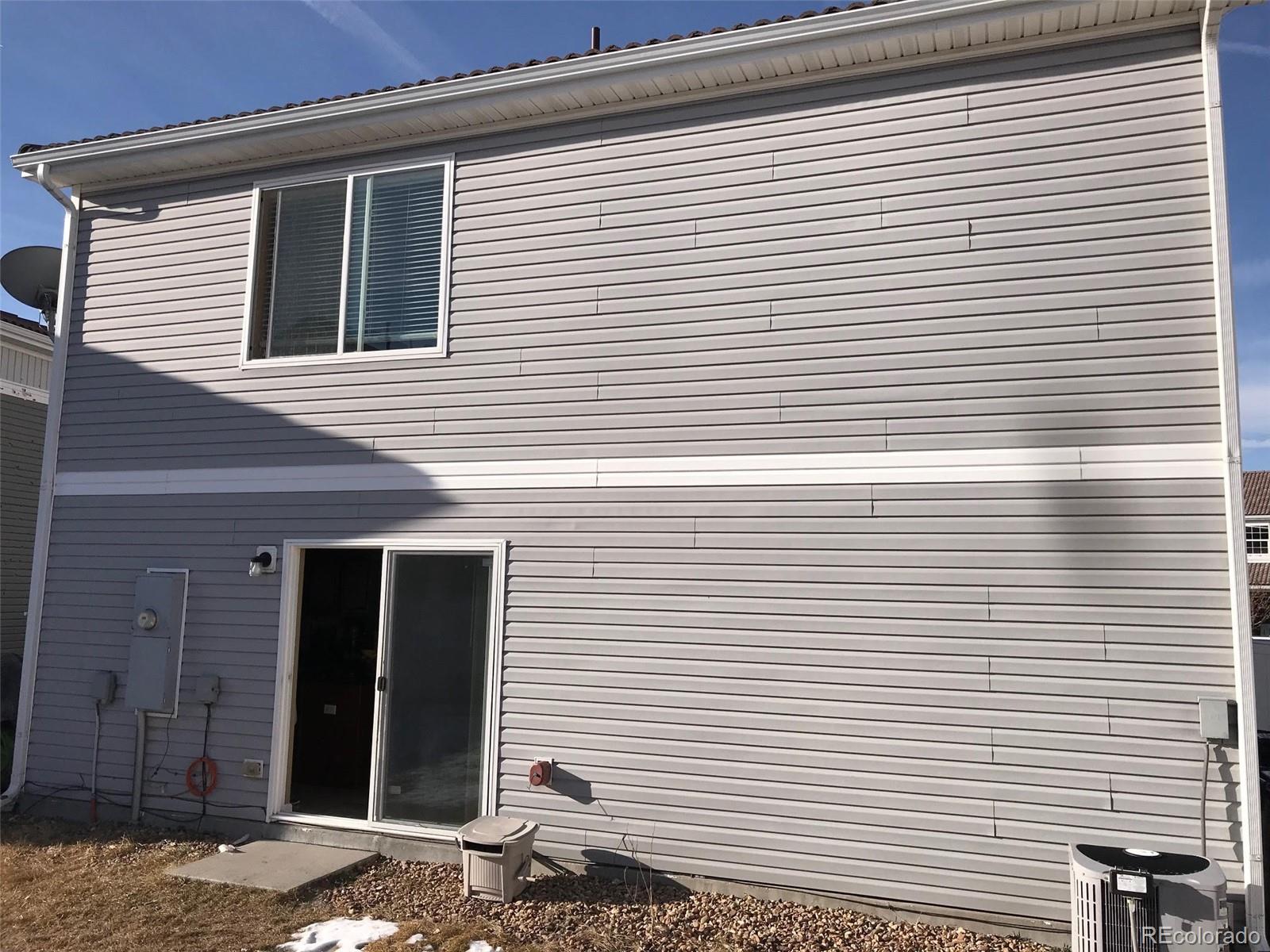 5556 Flanders Way Denver, CO 80249 - Photo 10 of 23 a view of a house with a white door
