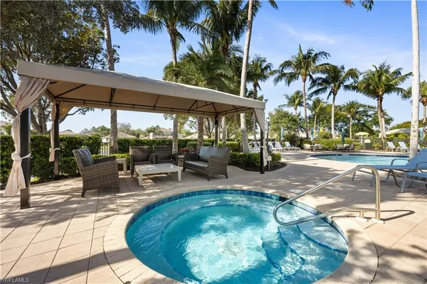 a view of a swimming pool with a patio