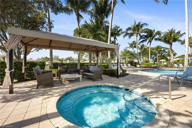 a view of a swimming pool with a patio