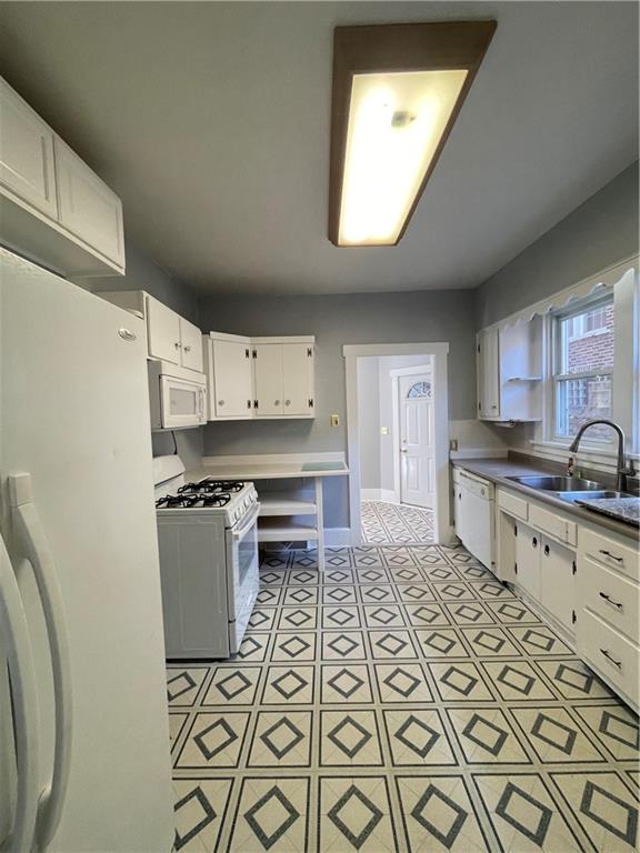 519 North Monroe Street Butler, PA 16001 - Photo 11 of 32 a kitchen with granite countertop a sink a stove a refrigerator and cabinets