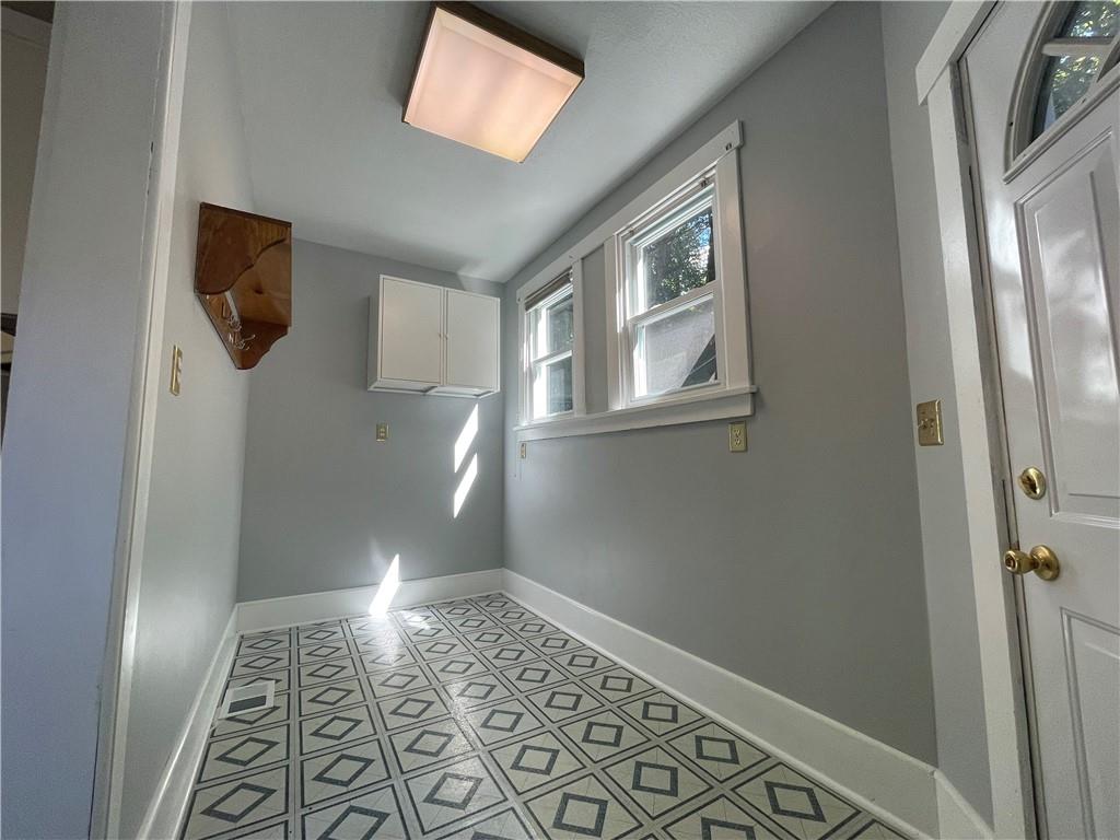 519 North Monroe Street Butler, PA 16001 - Photo 13 of 32 a view of an empty room with wooden floor and a window