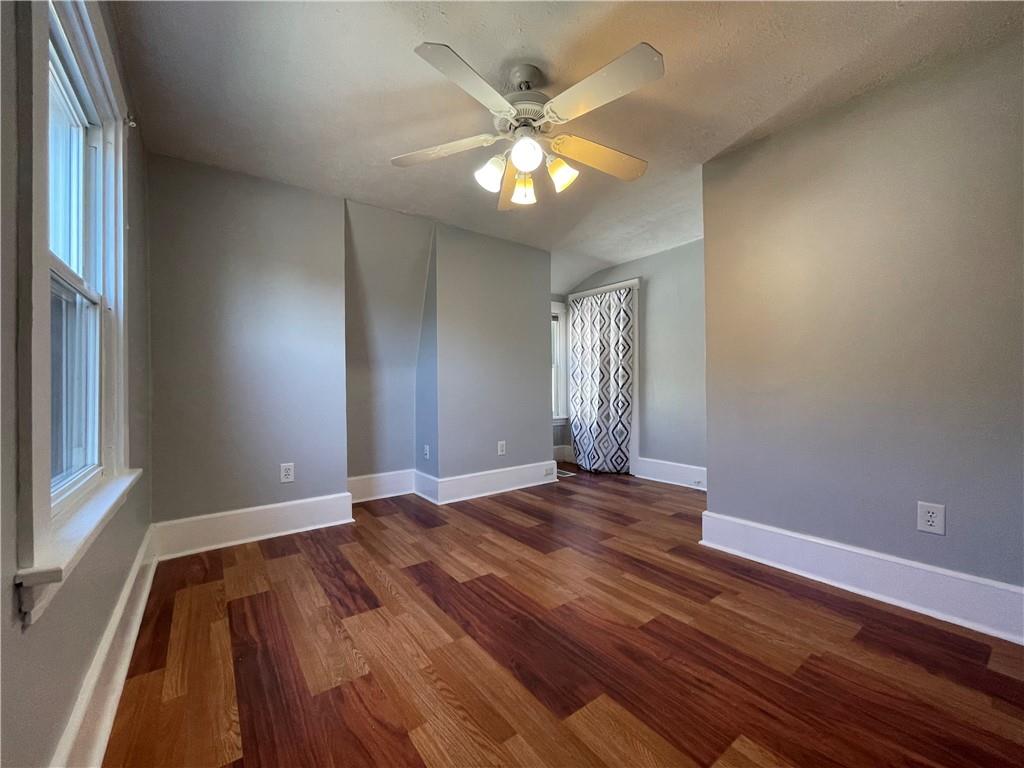519 North Monroe Street Butler, PA 16001 - Photo 18 of 32 a view of an empty room with wooden floor and a window