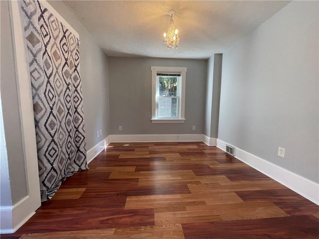 519 North Monroe Street Butler, PA 16001 - Photo 20 of 32 a view of an empty room with wooden floor and a window