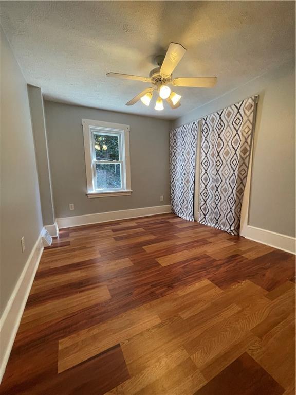 519 North Monroe Street Butler, PA 16001 - Photo 21 of 32 a view of an empty room with window and wooden floor