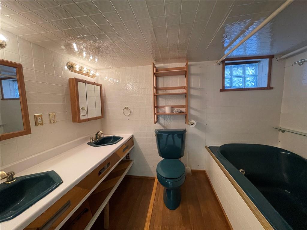 519 North Monroe Street Butler, PA 16001 - Photo 22 of 32 a bathroom with a sink and a mirror