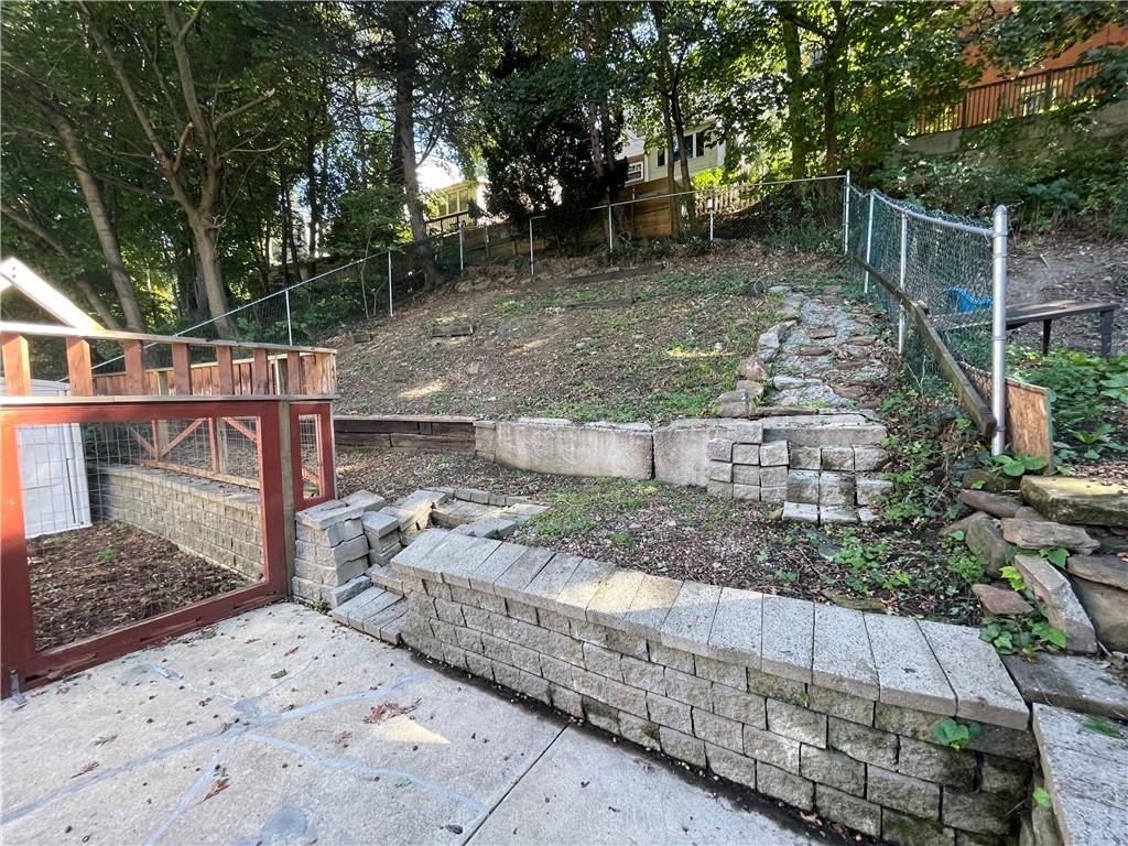 519 North Monroe Street Butler, PA 16001 - Photo 29 of 32 a backyard of a house with lots of green space