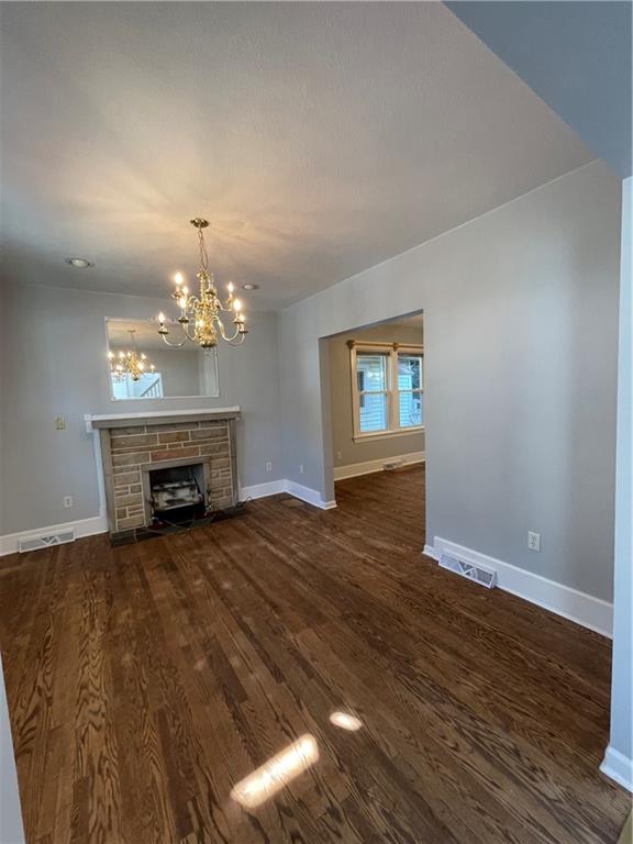519 North Monroe Street Butler, PA 16001 - Photo 7 of 32 a view of a livingroom with a fireplace wooden floor and chandelier