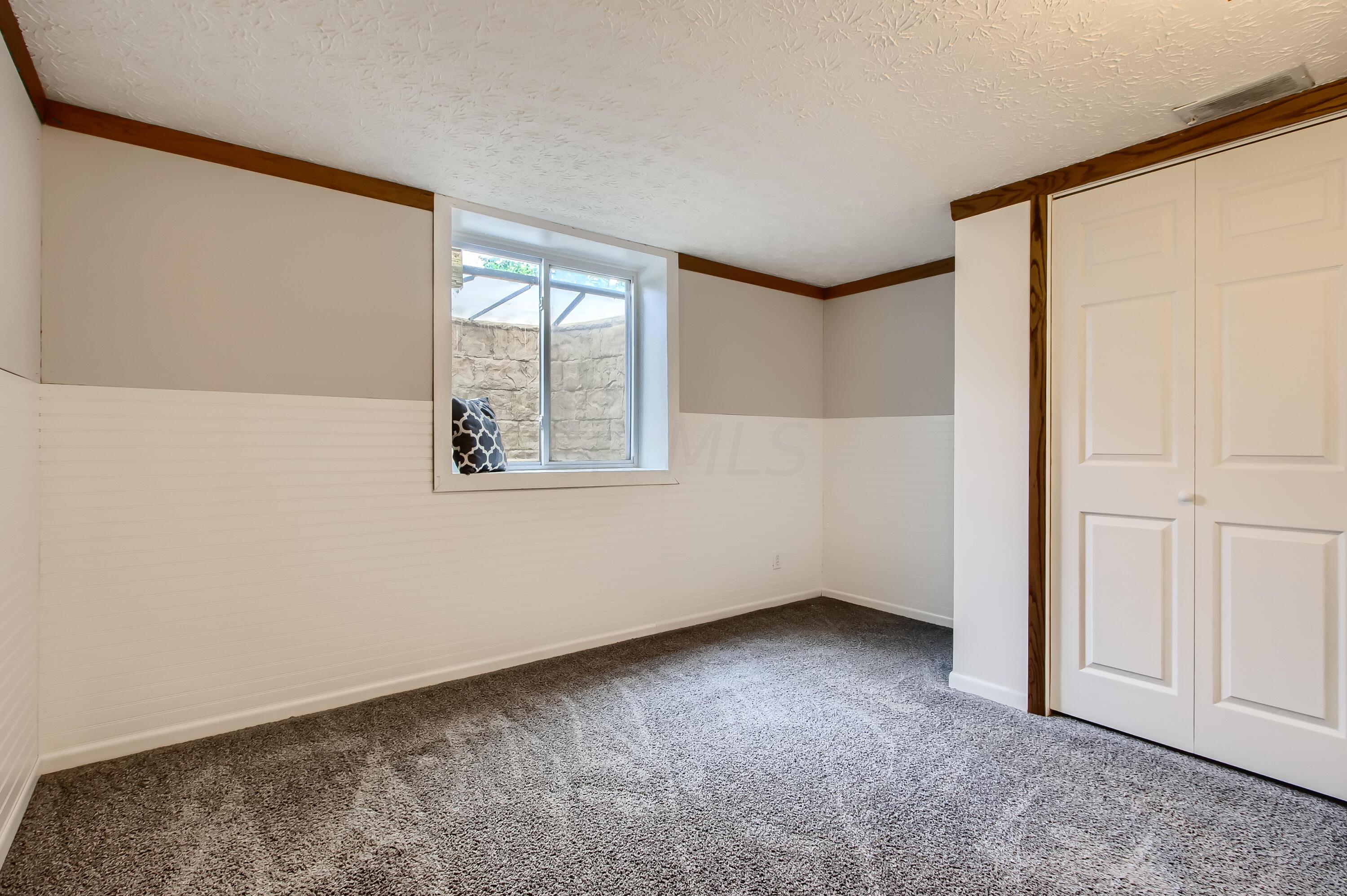 1781 Fishinger Road Columbus, OH 43221 - Photo 21 of 29 potential 5th bedroom in basement has egress window and closet